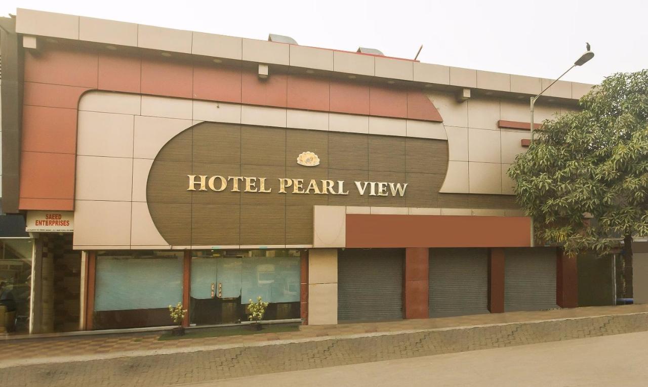 Capital O Hotel Pearl Near Us Embassy Bombaim Exterior foto
